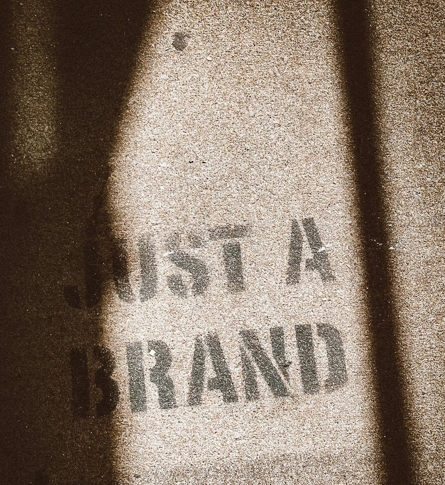 the shadow of a person standing in front of a sign